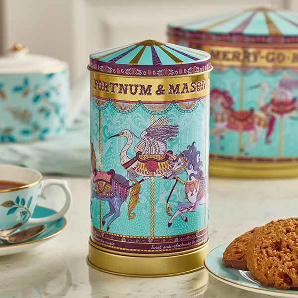 Small musical carousel biscuit tin with background